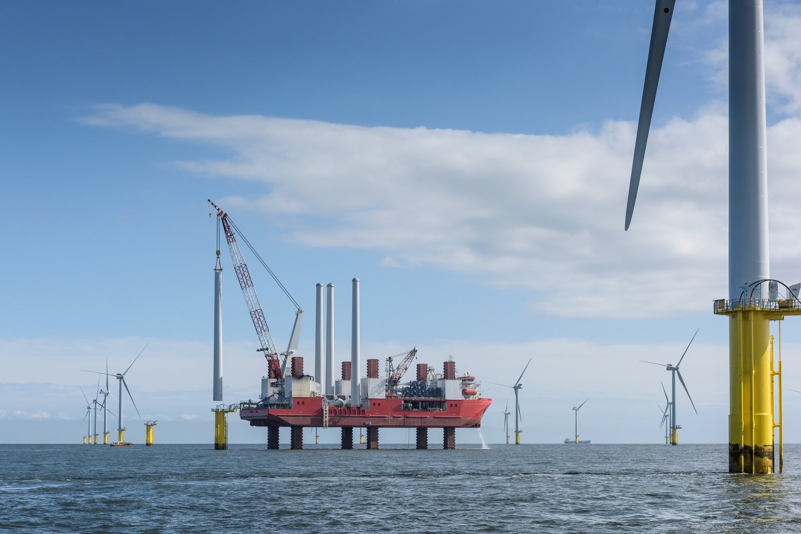View of offshore windfarm with construction ship